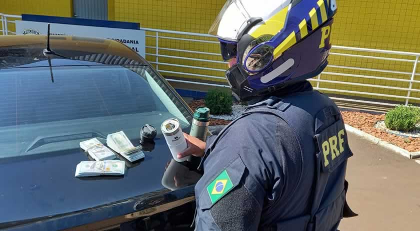 Mais de 60 mil dólares escondidos em copos térmicos e bolsa são apreendidos